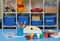 Children`s room with drawing facilities on the table. Pencils, markers, paints and drawing sheets are laid out on the children`s