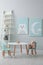 Children`s room with table and cute pictures on wall