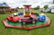 Children`s roundabout with classic Austin pedal cars