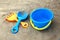 Children`s shovel and rake and bucket lie on the sand