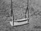 Children`s swing on the Playground, black and white