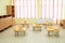 Children\\\'s tables and chairs. Modern kindergarten or preschool, spacious interiors, storage lockers