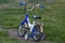 Children`s teenage bike blue on green lawn