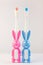 Children's toothbrushes in a form of cute bunnies on a white background isolated. Two rabbits with blank heart