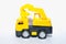 Children`s toy, excavator car, on wheels, white background