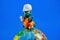 Children`s toy figure - architect-Builder with drawings on the globe of the Earth. The toy is a reduced model of a fictional