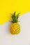 Children\\\'s toy pineapple isolated on a background in trendy colors. Color of 2021. Yellow  grey isolate