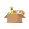 Children`s toys in a cardboard box. There is a teddy bear, a truck, a ball, cubes and a giraffe