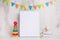 Children`s toys, with a white frame The frame on a light background of the wall with children`s signs, for design, layout. Baby