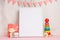 Children`s toys, with a white frame The frame on a light background of the wall with children`s signs, for design, layout. Baby