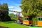 Children`s train with cars moving on rails in the amusement Park