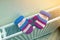 Children`s warm hand knitted striped woolen gloves drying on heating radiator after winter day outside
