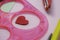 Children\\\'s workplace for making crafts. Cutting multi-colored hearts from foamiran.