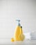 Children's yellow dispenser with baby shampoo, comb and duck on the table. The concept of daily child care.