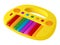 Children`s yellow toy electric piano with multicolored keys and buttons