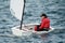 Children sailing racing dinghies at championships. April 18, 2