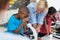 Children scholar looking through microscope