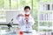 The children, scientist is standing in front of his own experiment in the lab. Young kids in science lab study samples. Test for