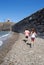Children searching stones in a beach of Collioure, Colliure, small french village with a fortress in a sunny day of summer.