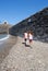 Children searching stones in a beach of Collioure, Colliure, small french village with a fortress in a sunny day of summer.