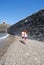 Children searching stones in a beach of Collioure, Colliure, small french village with a fortress in a sunny day of summer.