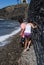 Children searching stones in a beach of Collioure, Colliure, small french village with a fortress in a sunny day of summer.