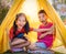 Children siblings having a good time in camping coming out with full smile and suprise face for kid healthy lifestyle