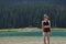 Children, siblings playing in the water. Black lake in the Durmitor mountains near Zabljak. A beautiful place in Montenegro