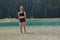 Children, siblings playing in the water. Black lake in the Durmitor mountains near Zabljak. A beautiful place in Montenegro