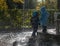 Children silhouettes under the rain of the fountain