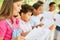 Children sing together in the choir during choir practice