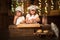 Children sisters cook with a rolling pin to stretch concept of