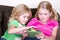 Children or sisters using tablet