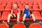 Children sit in sports stands