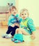 Children sitting on chamber pots