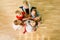 Children sitting on a floor in a circle