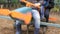 Children sitting on the toy layout blue plane