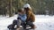 Children sledding on snow. Active fun for family Christmas vacation