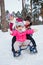 Children on sleds in snow