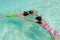 Children snorkeling in sea