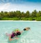 Children snorkeling in sea