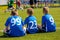 Children Soccer Team Watching Football Match. Children Sport Team in Blue Shirts