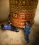 Children spinning prayer wheel