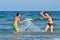 Children splashing at the sea