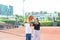 Children and sports. Teenage girl playing basketball on the playground.