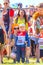 children in a sports uniform are worried before the start in city competitions to overcome obstacles. Text in Russian: race of he