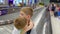 Children stand in the baggage claim area at the airport