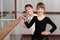 Children standing at ballet barre