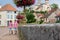 Children standing in front of flower pots in the town of Chatillon sur Seine