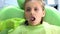 Children stomatologist examining teeth with mouth mirror, routine examination